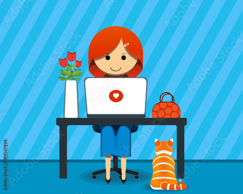 Girl designer or woman programmer at work with flowers and cat