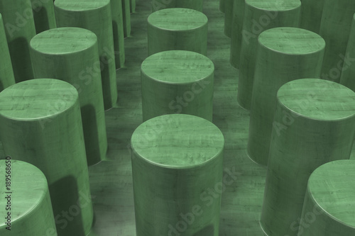 Plain green wooden surface with cylinders photo