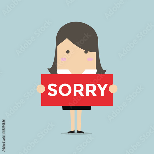 Businesswoman hands holding sorry sign.