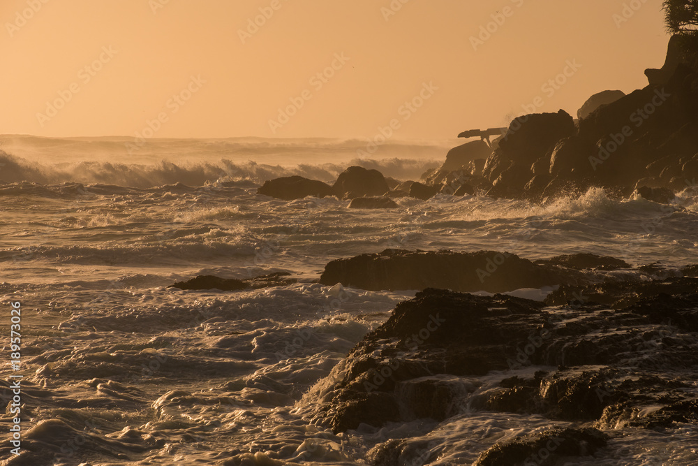 Gold Coast, Queensland/Australia - 18 January 2018: Sunlit waves at sunrise from Snapper Rocks on the Southern Gold Coast, Australia.