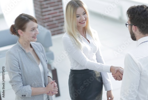Wallpaper Mural handshake business partners in the office. Torontodigital.ca