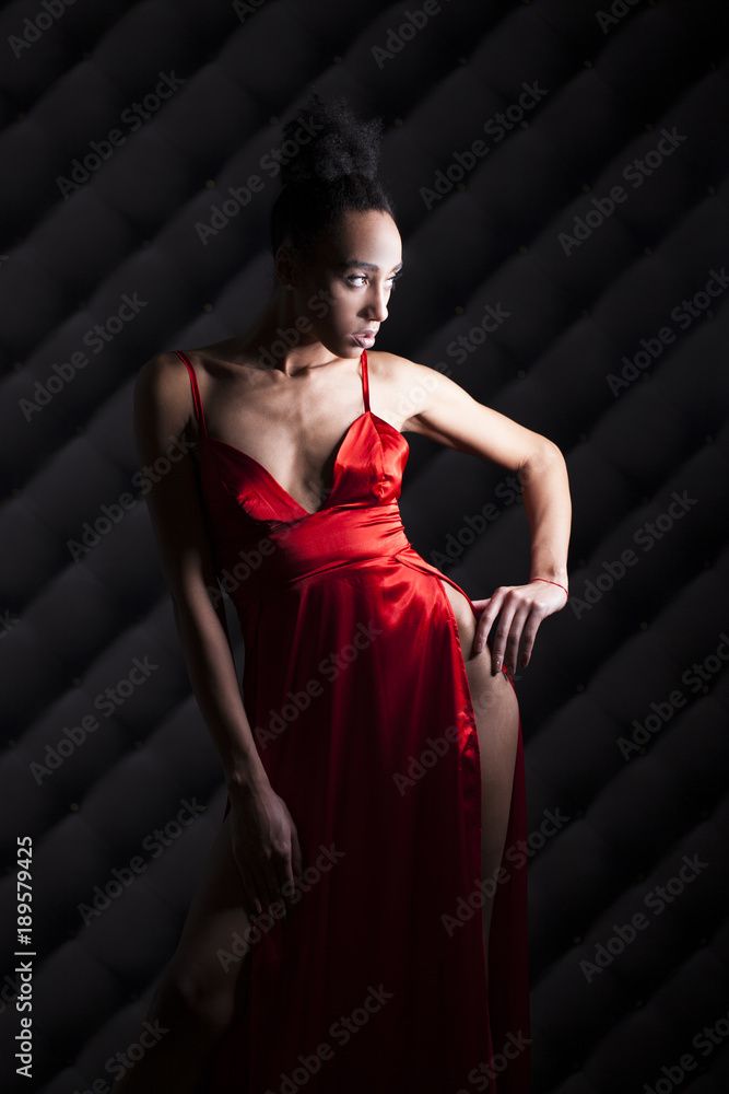 Portrait of sensual young african woman in red dress