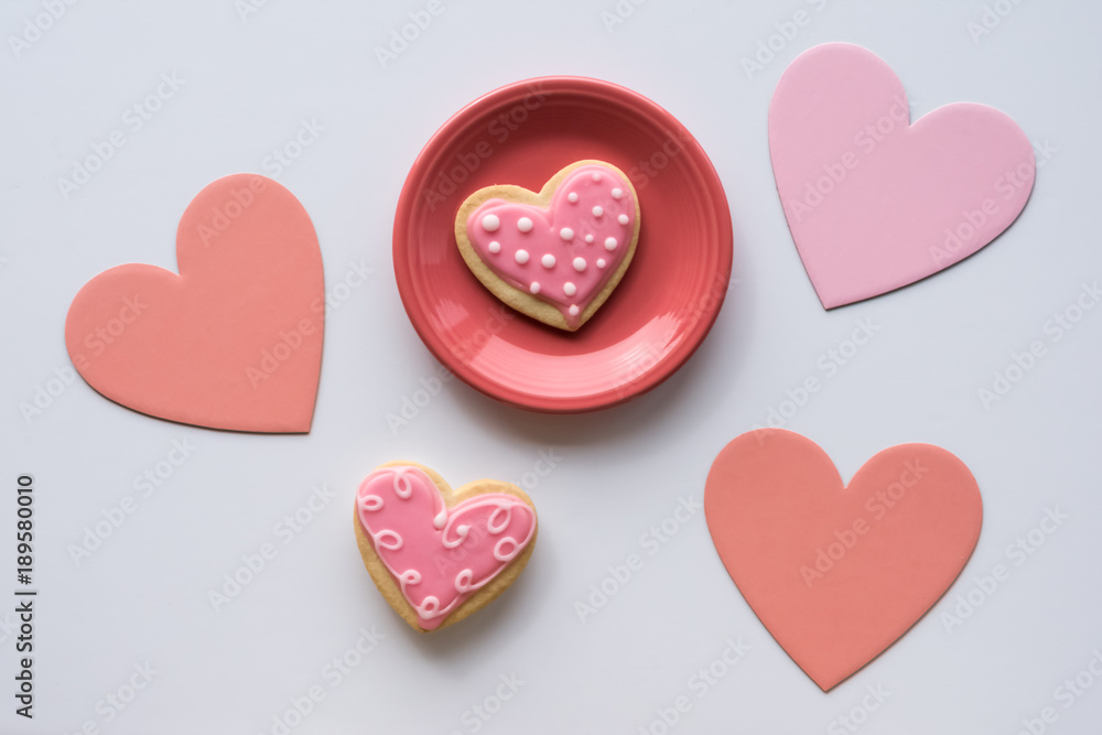 Fototapeta premium Pink Frosted Sugar Cookies on White Background