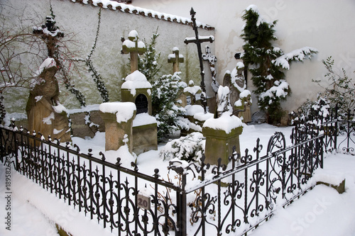 winter snowy cemetery in Prerov nad Labem, Central Bohemian region, Czech republic photo