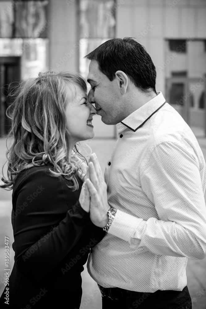 A middle-aged couple in love enjoys each other in embraces. The concept of relations without barriers, love and sincerity are all that is needed for happiness A middle-aged couple in love enjoys each other in embraces. The concept of relations without barriers, love and sincerity are all that is needed for happiness