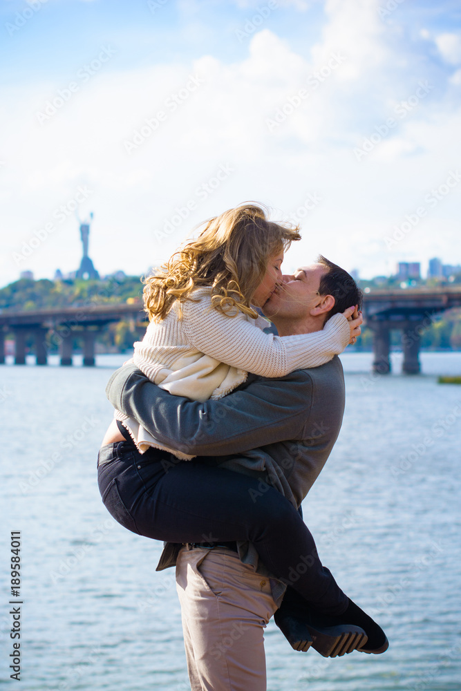A middle-aged couple in love enjoys each other in embraces. The concept of relations without barriers, love and sincerity are all that is needed for happiness 