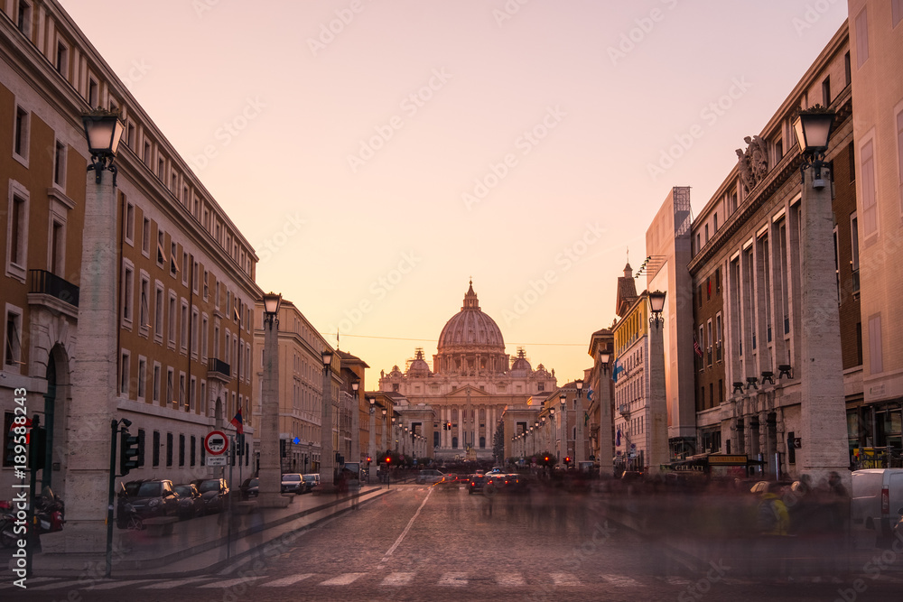 VATICAN - ITALY - December 24 2017 - St Peters Basilica at sunset, with golden light and no people.