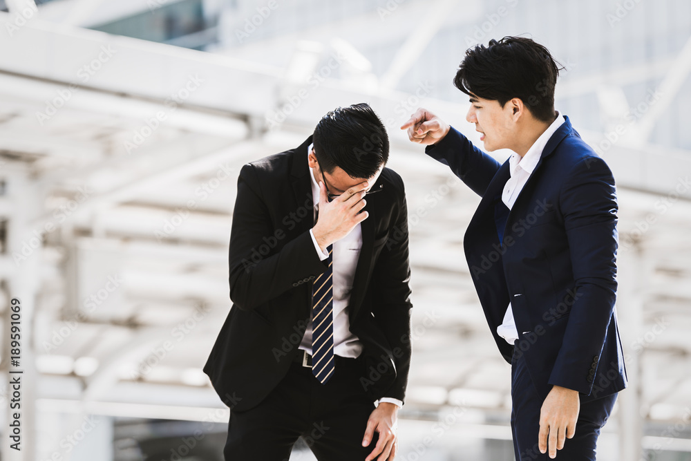 Asian businessman angry worker background city. Business concept Asian businessman angry worker background city. Business concept