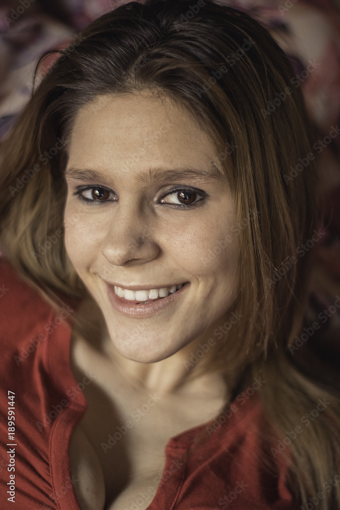 Girl with red shirt on defocused background