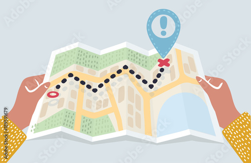Hands holding abstract city map with pin. Folded Map in man hand