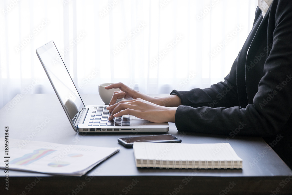 woman working with laptop,working on desk,laptop computer working by business woman,Office wokeplace environment,woman hands at work,Typing laptop keyboard. woman working with laptop,working on desk,laptop computer working by business woman,Office wokeplace environment,woman hands at work,Typing laptop keyboard.