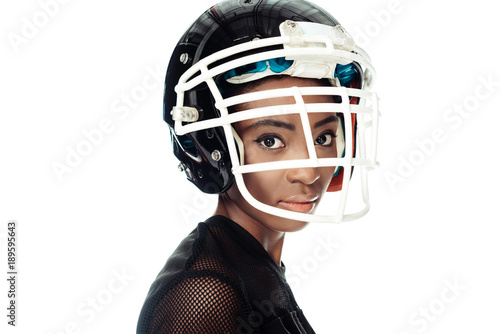 close-up portrait of female american football player in helmet isolated on white