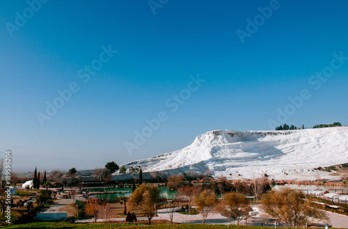 White calcium limestone landscape and thermal pool in Pamukkale, Denizili, Turkey