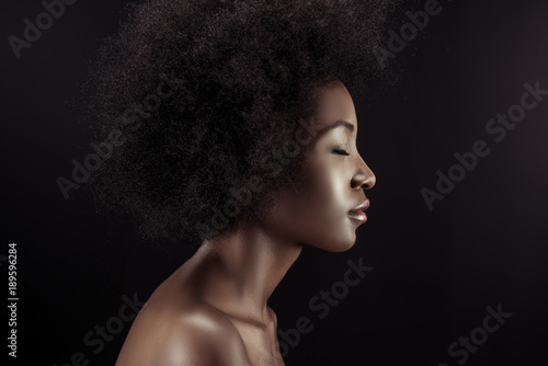 profile of attractive african american woman isolated on black