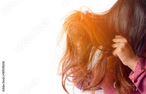 Damaged Hair. Beautiful Sad Young Woman With Long Disheveled Hair. Closeup Portrait Of Female Model Holding Messy Unbrushed Dry Hair In Hands. Hair Damage, Health And Beauty Concept. High Resolution photo