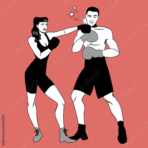 The war of the sexes. Beautiful girl boxer hitting her handsome opponent with a left hook