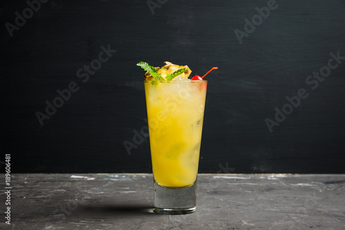 Sweet cocktail with pineapple and rum. Selective focus.