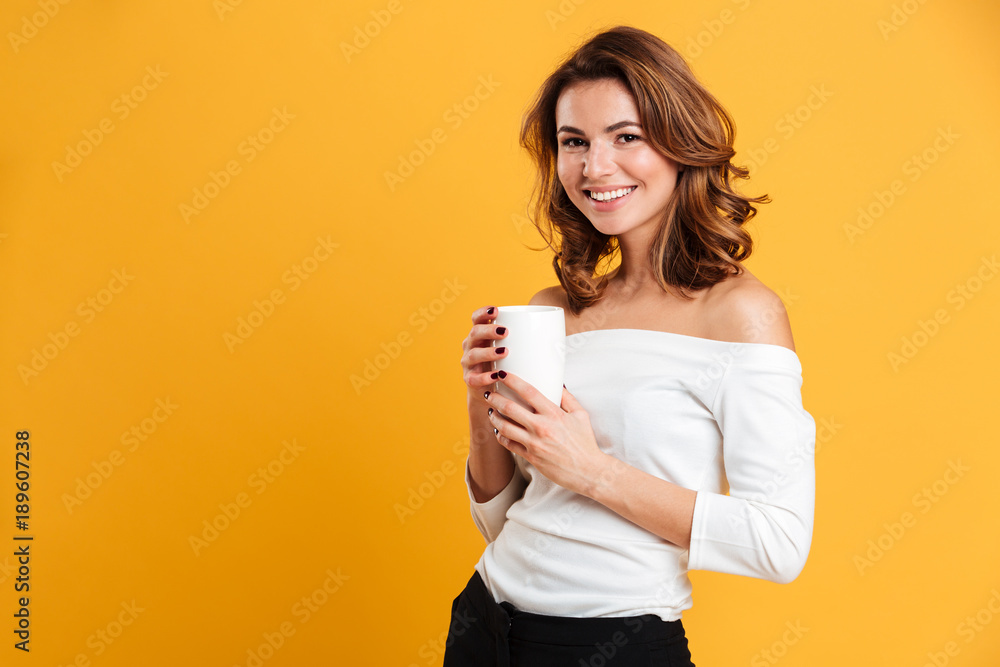 Beautiful young woman drinking tea. Beautiful young woman drinking tea.