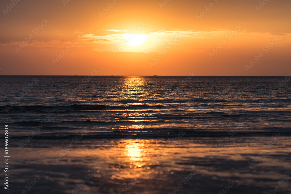 Beautiful sunset with sea and beach.