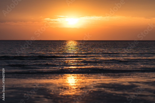 Beautiful sunset with sea and beach.
