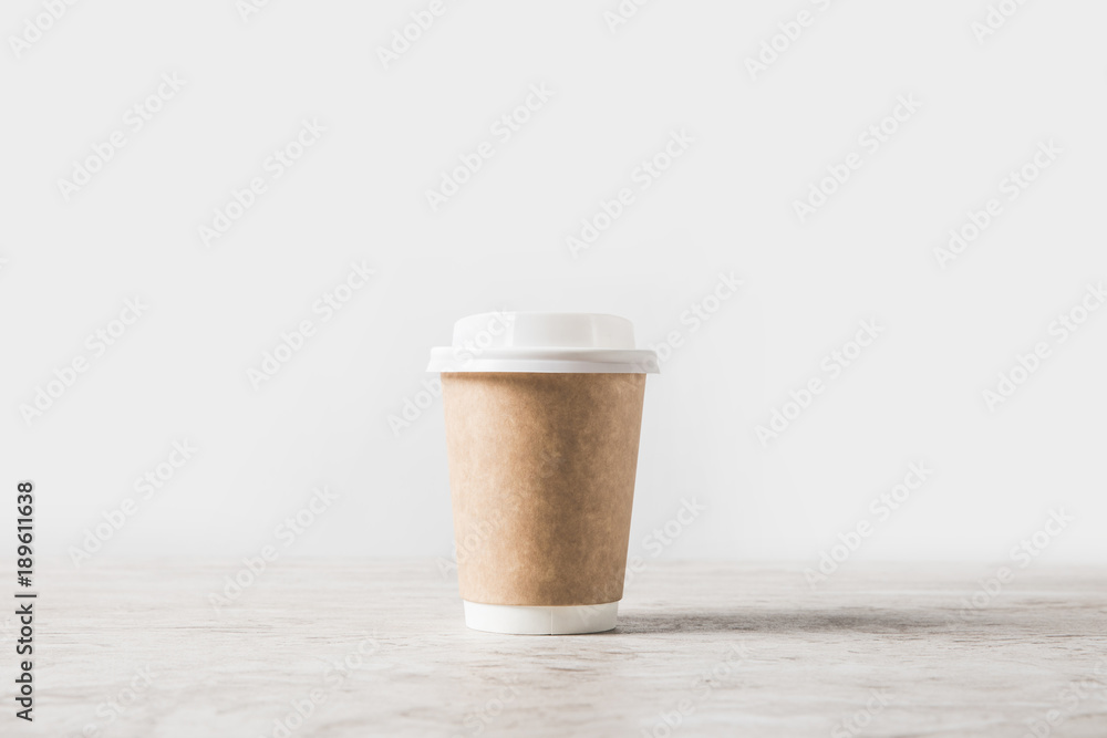 one disposable coffee cup on marble table on white one disposable coffee cup on marble table on white
