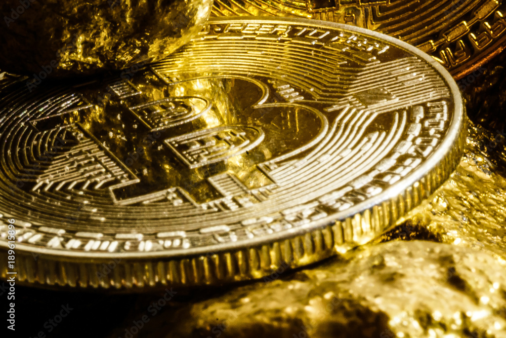 Golden bitcoin coin and mound of gold bitcoin cryptocurrency business