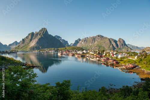 Reine at Lofoten islands in northern Norway on a sunny summer evening. Reine is a picturesque fishing village and a popular travel destination.