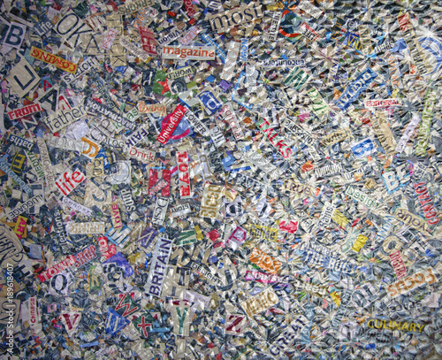 random  magazine letters under a pice of textured glass