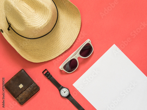 Flat lay traveler accessories on pink background with blank space for text. Top view travel or vacation concept. Summer background.