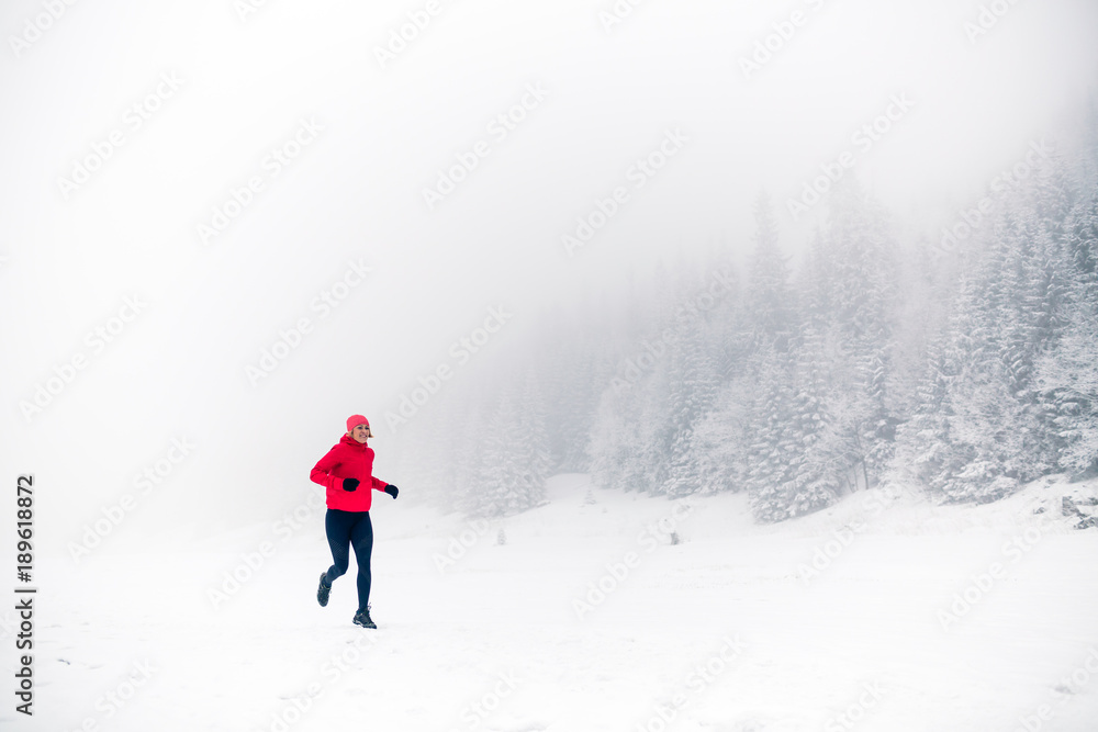 Trail running on snow in winter mountains Trail running on snow in winter mountains