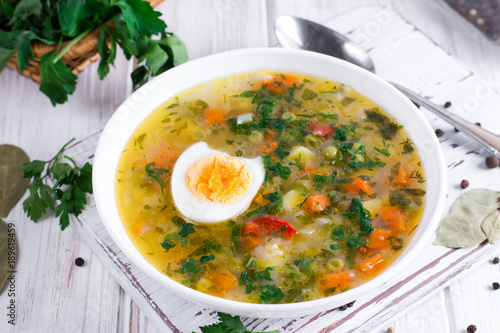 Summer vegetable soup with beans, peas, corn, carrots, chicken, egg, tasty healthy dish for the diet