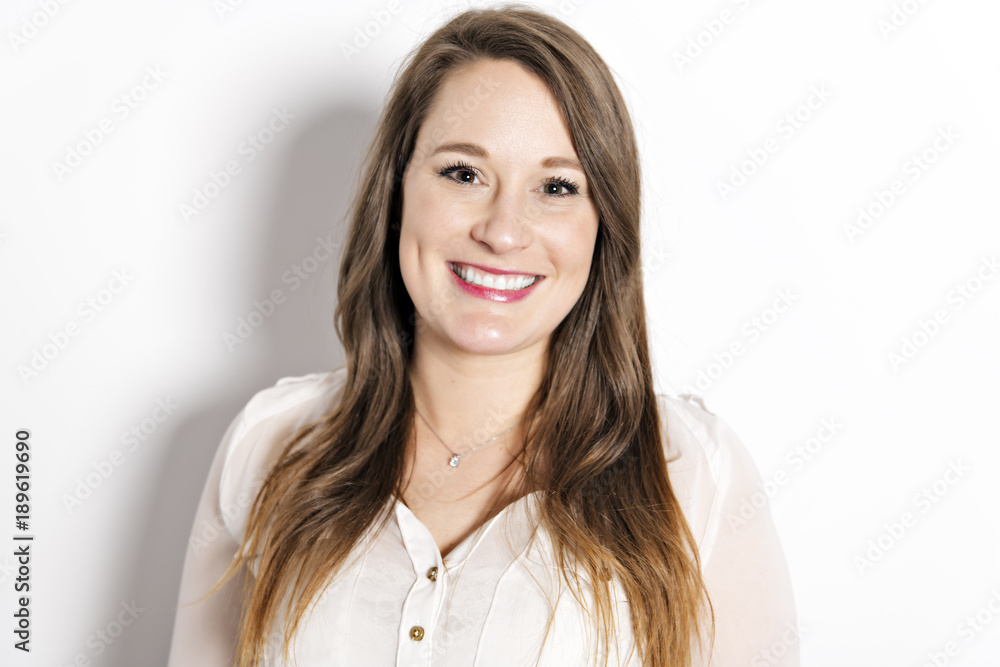 Portrait of a woman with a long brown hair on gray background isolatad Portrait of a woman with a long brown hair on gray background isolatad