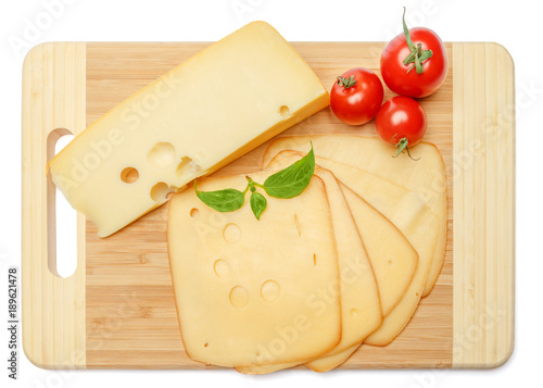 swiss cheese or cheddar and tomatoes on white background
