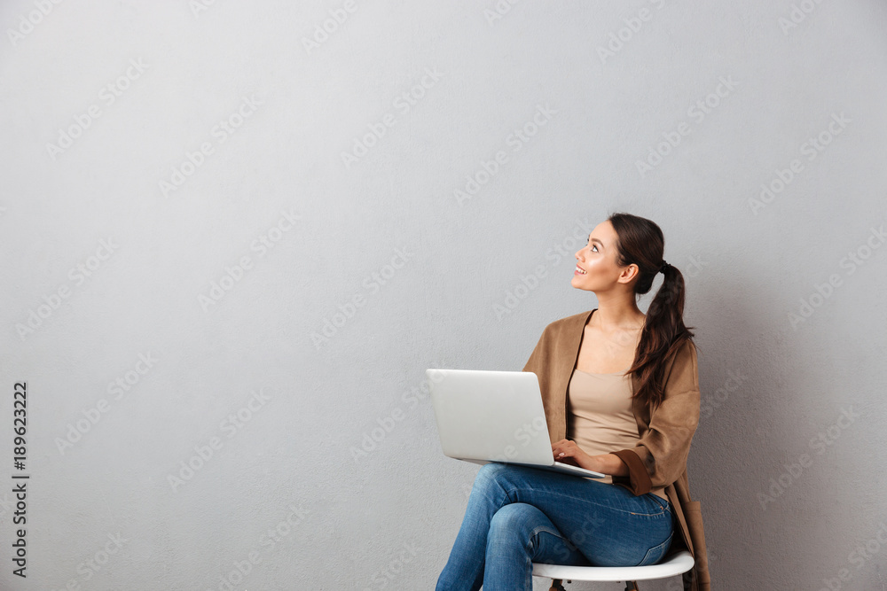 Full length portrait of a smiling casual asian woman Full length portrait of a smiling casual asian woman