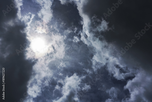 Sun and rain clouds before thunderstorm background