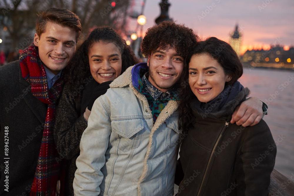 Portrait Of Friends Walking Along South Bank On Visit To London Portrait Of Friends Walking Along South Bank On Visit To London
