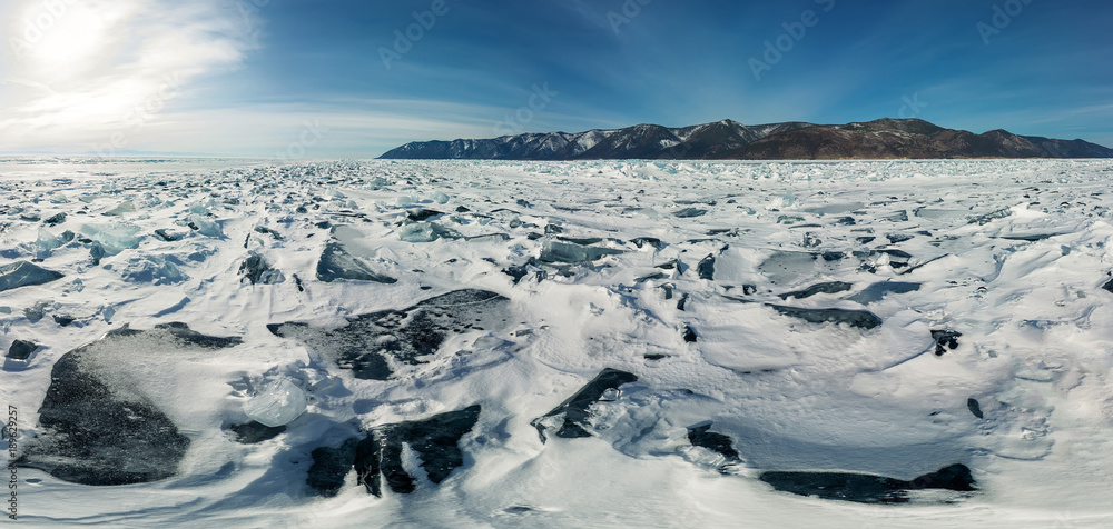 Panorama of the blue hummocks of Lake Baikal at sunset