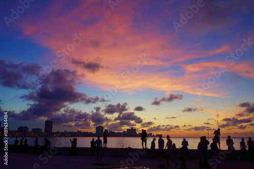 Sunset at Malecon, the famous Havana promenades where Habaneros, lovers and most of all individual fishermen meet, Havana, Cuba