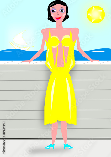 Mujer con traje de diseño posando frente al mar en un día espléndido de sol