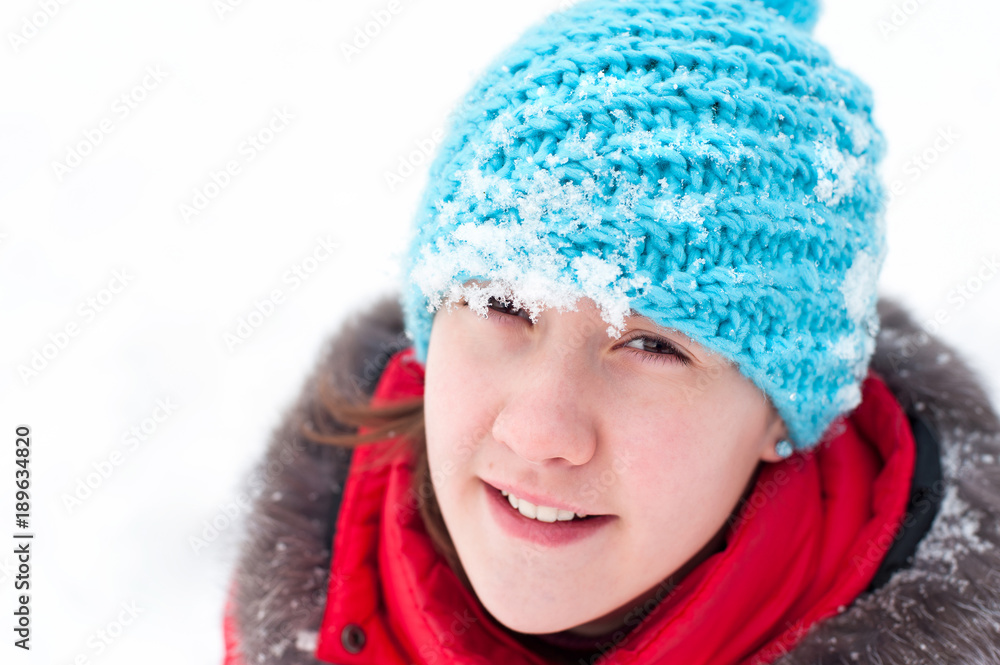 Closeup portrait of cheerful teenage girl in summer woolen hat Closeup portrait of cheerful teenage girl in summer woolen hat