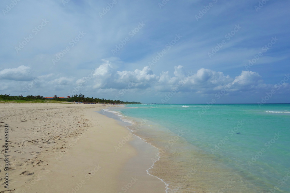 The famous tropical beach of Varadero in Cuba with a calm turquoise ocean