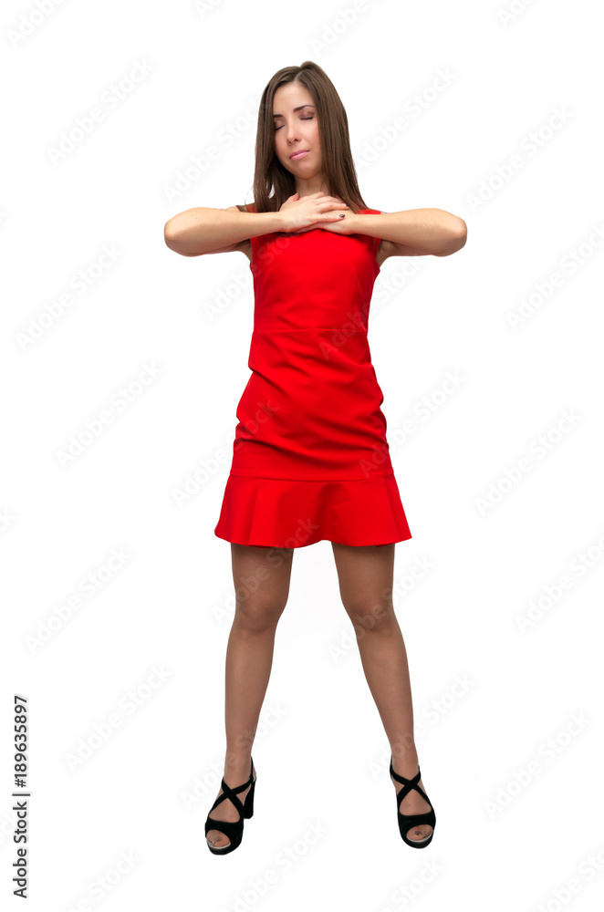 Happy surprised girl in red dress in stockings and in high heels shoes is standing is posing and is dancing on isolated on white background. Happy surprised girl in red dress in stockings and in high heels shoes is standing is posing and is dancing on isolated on white background.