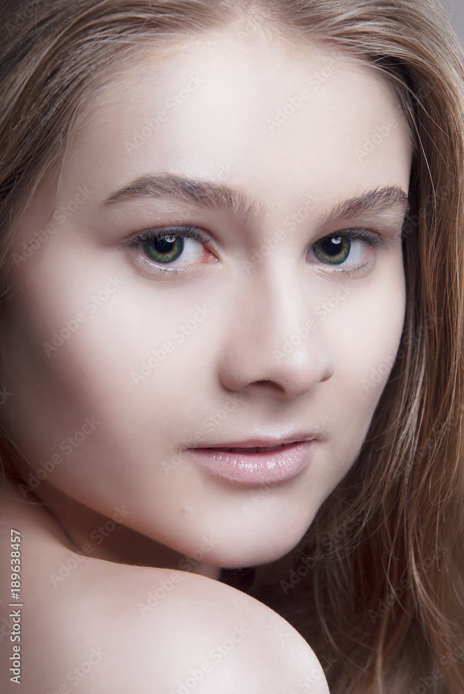 Fototapeta premium Blonde girl with Nude makeup and clean skin close-up