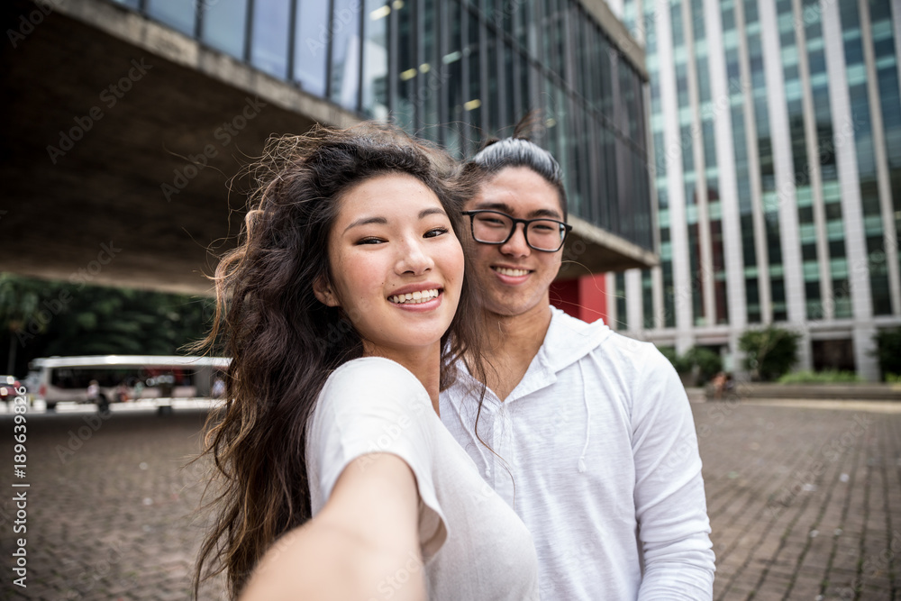 Fototapeta premium Asian Couple Taking a Selfie