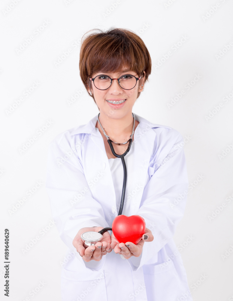 Doctor holding the red heart and stethoscope. Isolated on white background. Studio lighting. Concept for healthy Doctor holding the red heart and stethoscope. Isolated on white background. Studio lighting. Concept for healthy
