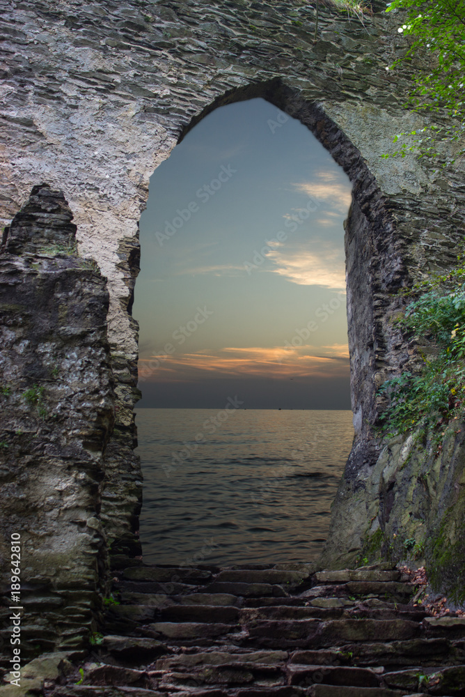 Looking at the sunset over the stone gate