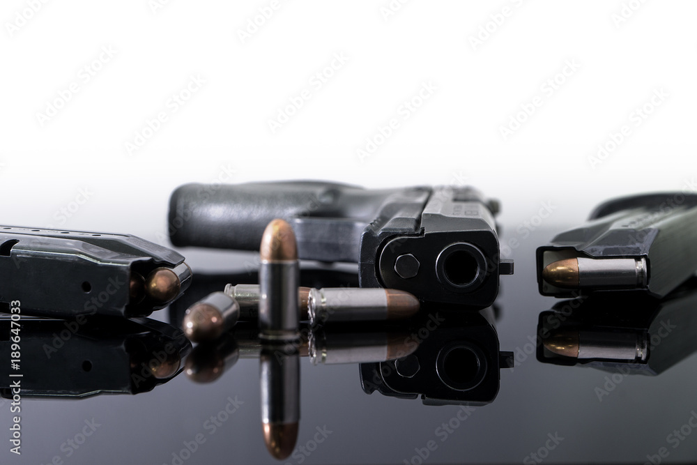 9mm Pistol gun with ammunition, Bullets and magazine on white background. Gun isolated.