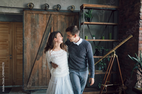 Obraz na płótnie Cheerful couple having fun together. Newlyweds laughing and go crazy. Artwork. Wedding indoors. Soft focus w salonie
