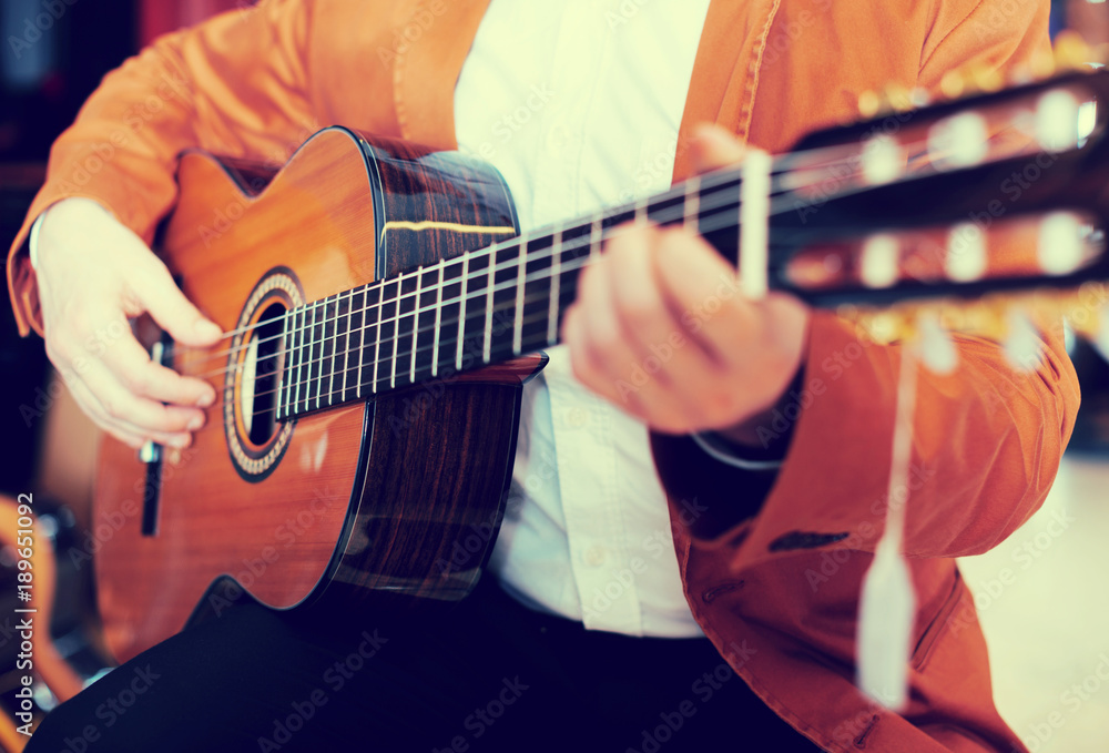 Fototapeta premium Professional guitarist practicing on guitar