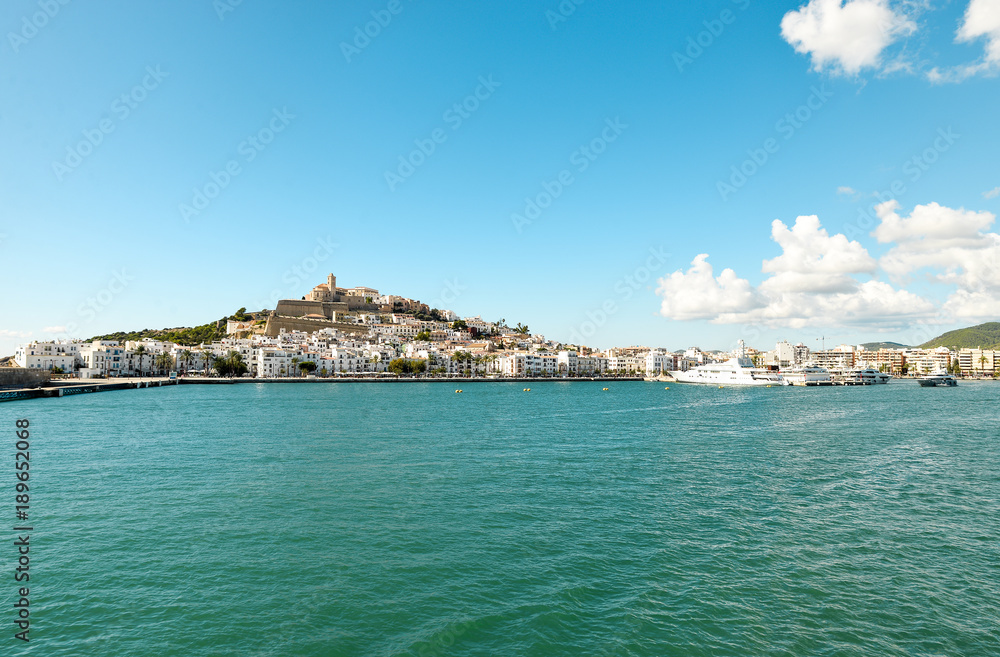 Ibiza, Spain - October 5, 2017 : Beautiful view of boat port and old town of Ibiza city and Formentera islands, Spain. Sea rest and holiday concept. View from boat and water. Popular summer resort.